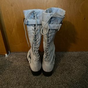 Laced up cream colored boots